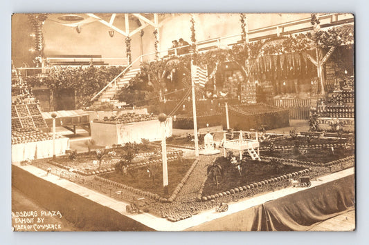 1911 RPPC of Healdsburg California plaza exhibit model showing miniature landscaped park with structures pathways and decorative display elements indoors