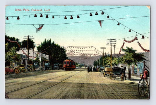 1911 Idora Park Oakland California streetcar scene with trolley tracks horse-drawn wagons early automobiles festive bunting posted divided back