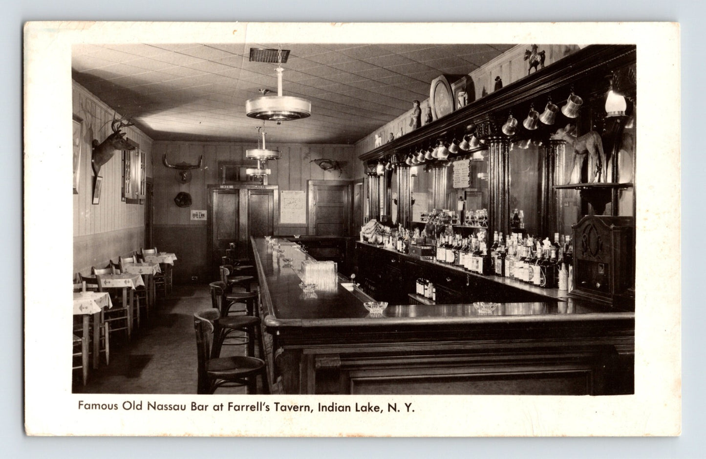 Indian Lake New York Farrells Tavern Old Nassau Bar interior 1940s photo showing long wooden bar with stools and back bar bottles
