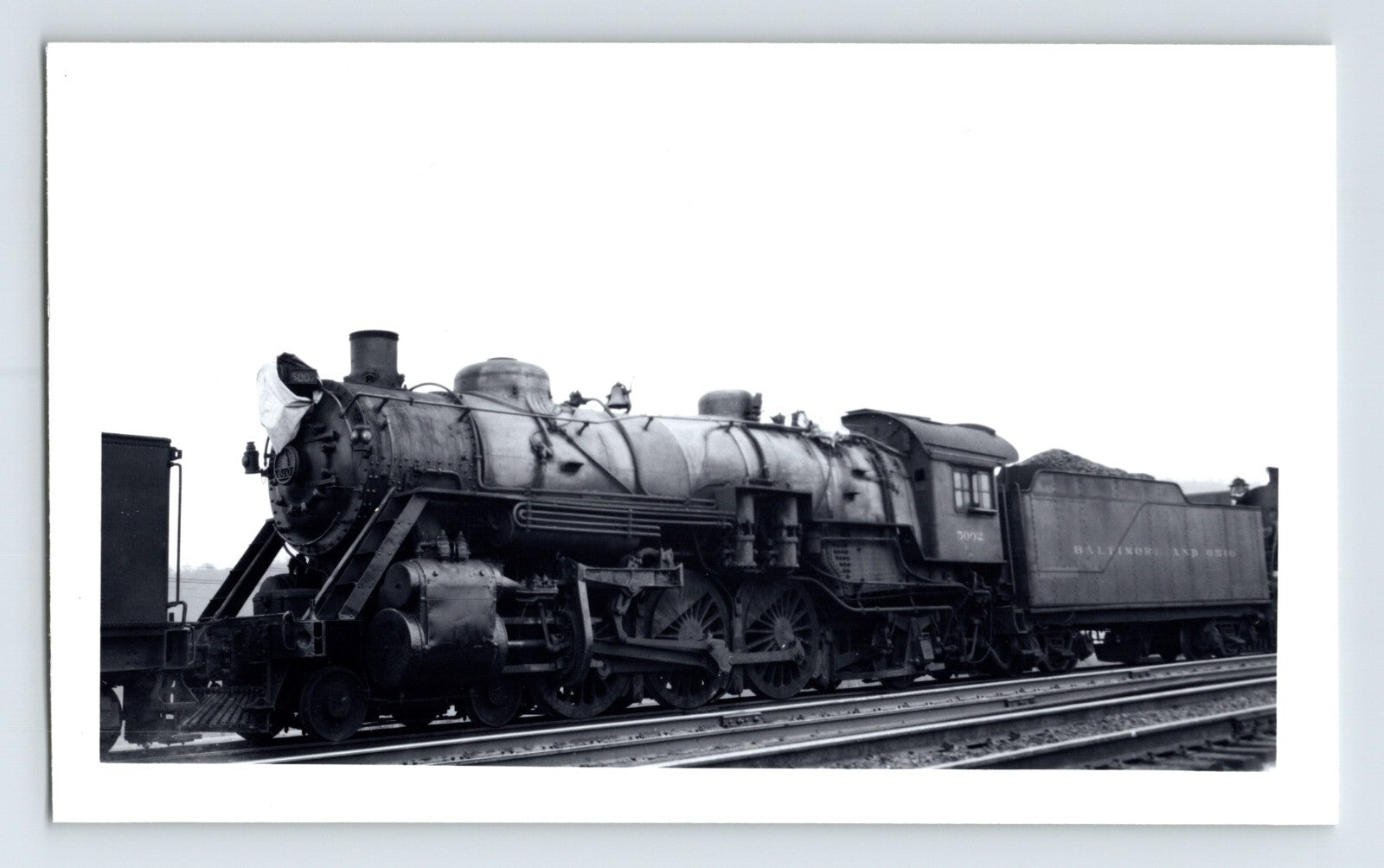 Black-and-white photograph of a Baltimore & Ohio Railroad steam locomotive, showing a 2-8-2 Mikado-type engine and tender positioned on rail tracks.