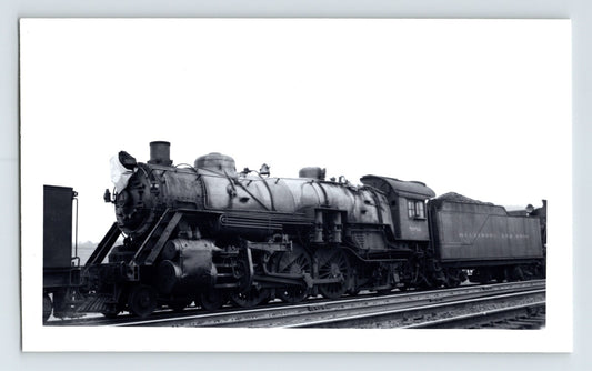 Black-and-white photograph of a Baltimore & Ohio Railroad steam locomotive, showing a 2-8-2 Mikado-type engine and tender positioned on rail tracks.