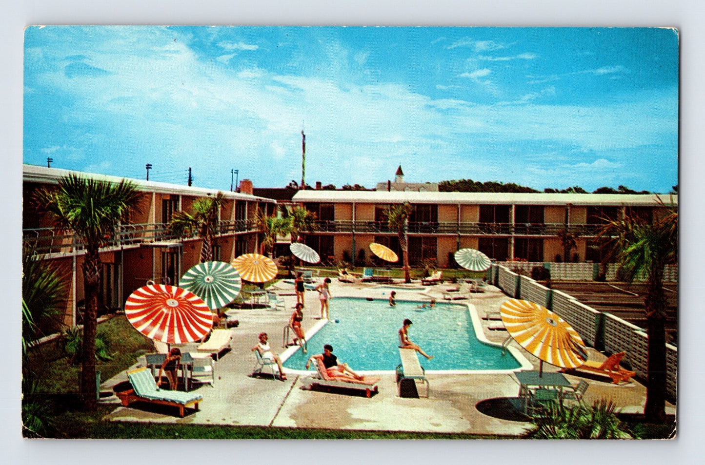 Myrtle Beach South Carolina Howard Johnson Motor Lodge pool courtyard 1960s postcard colorful umbrellas