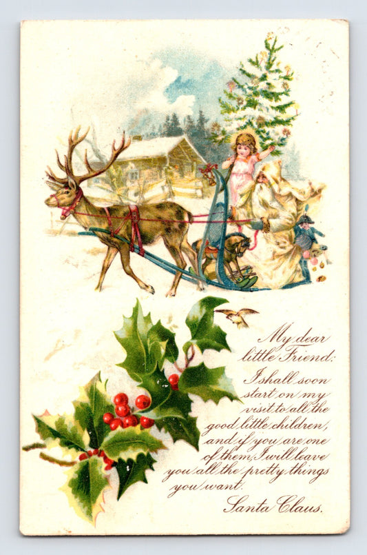 Colorful Christmas postcard showing Santa in yellow robe with little girl on sleigh pulled by reindeer and holly decoration 1910
