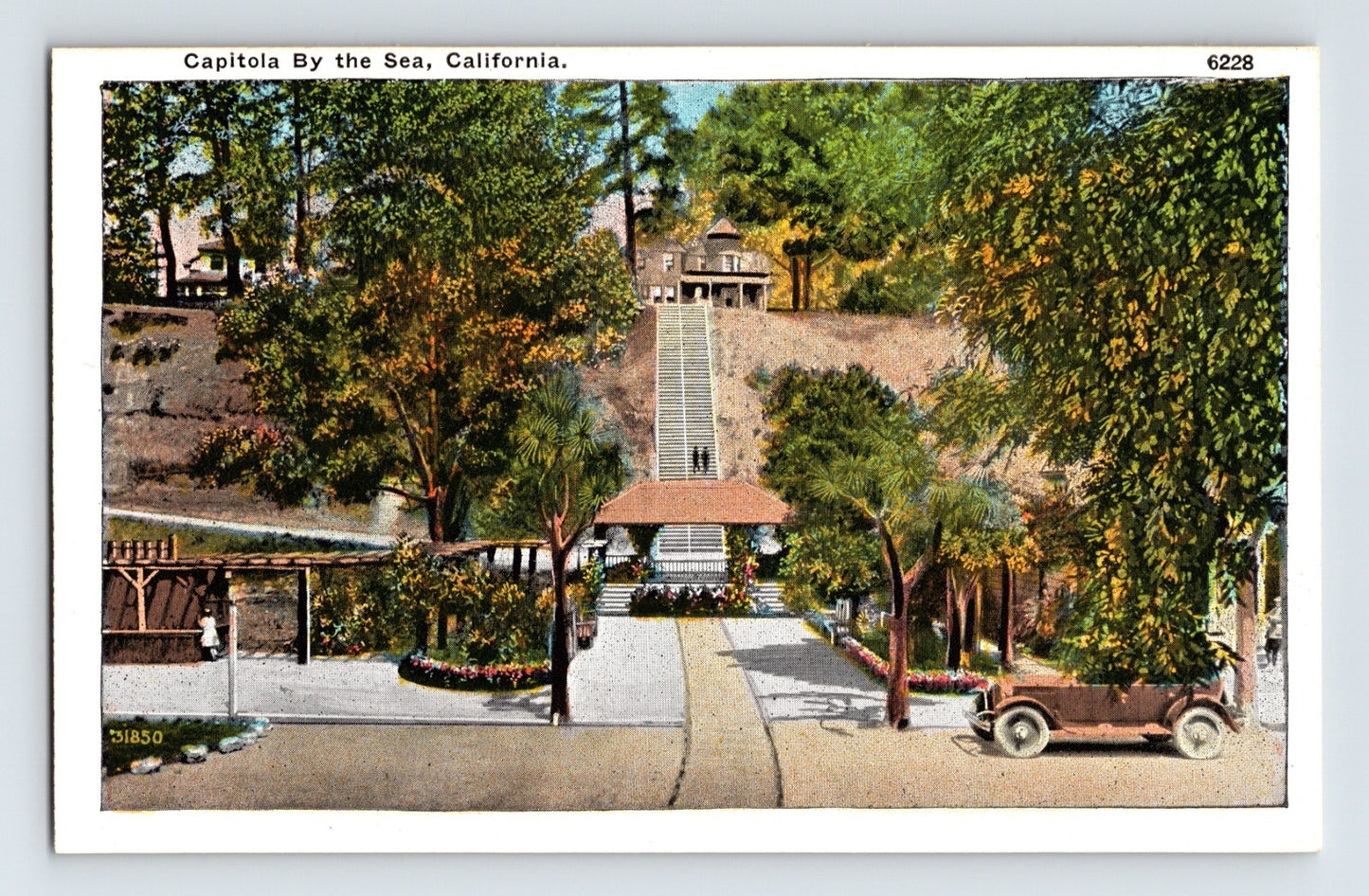 Vintage-style postcard of a scenic view with trees and a path leading to a building, labeled 'Capitola By the Sea, California'.