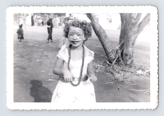 Child Halloween costume mask dress leis playground tree vintage snapshot
