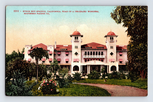 Byron Hot Springs California resort hotel with twin towers and red tile roof hand-colored 1910s postcard