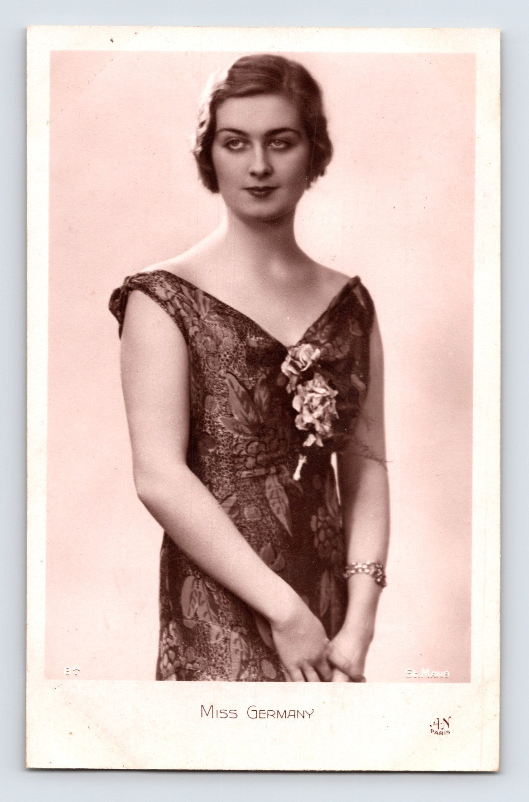 Sepia-toned real photo postcard portrait labeled Miss Germany, showing a formally dressed beauty pageant or promotional model in elegant 1930s evening attire.