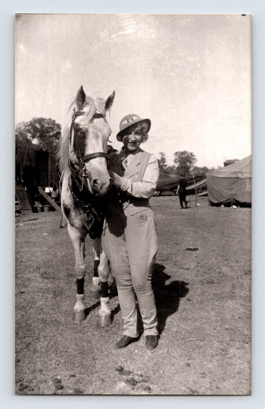 Barnes Sells Floto Circus woman performer standing with white horse circus grounds tents 1940s photograph