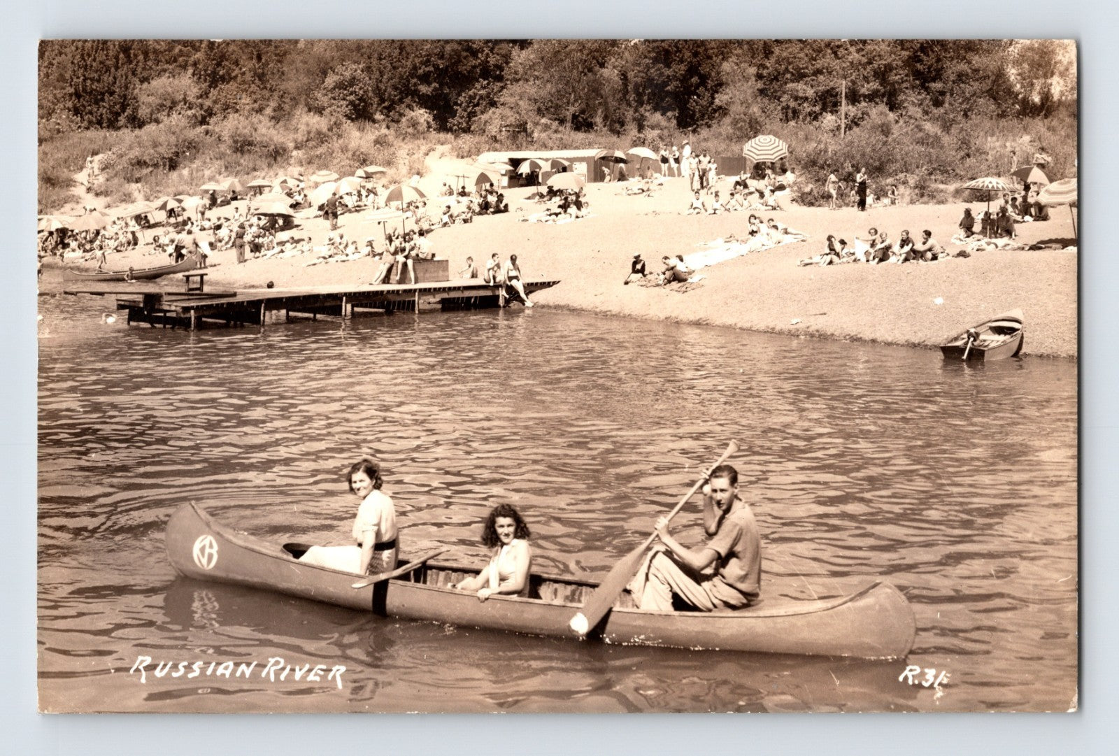 Russian River California canoe boating beach scene RPPC postcard with swimmers umbrellas and summer recreation