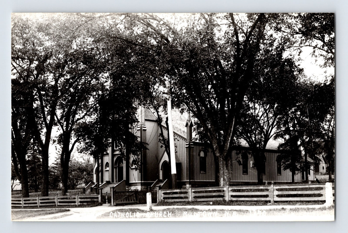 Milltown New Brunswick Catholic Church tree lined church building Devolite postcard