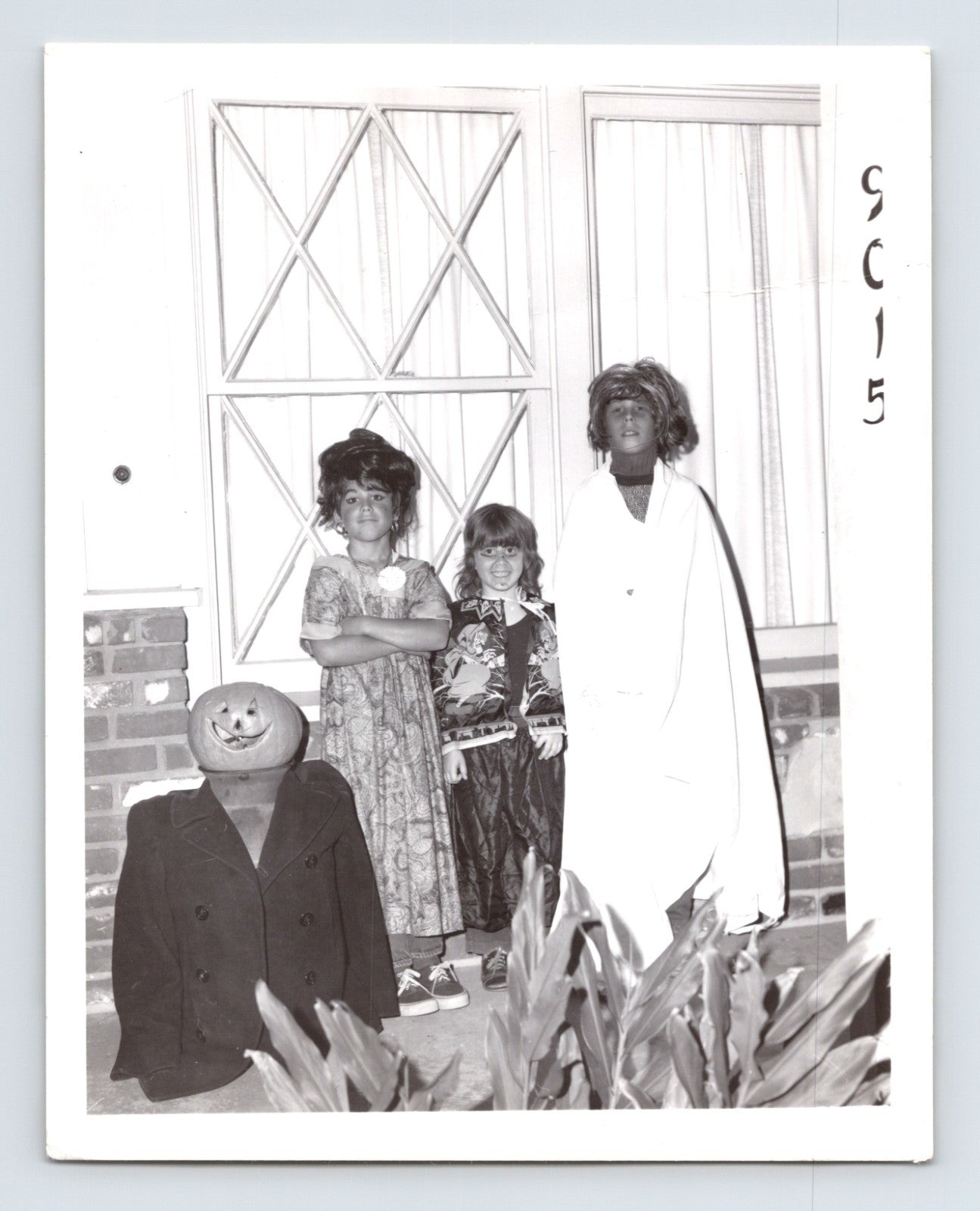 Children Halloween costumes porch jack o lantern figure ghost outfit group 1960s snapshot photo 5 x 4