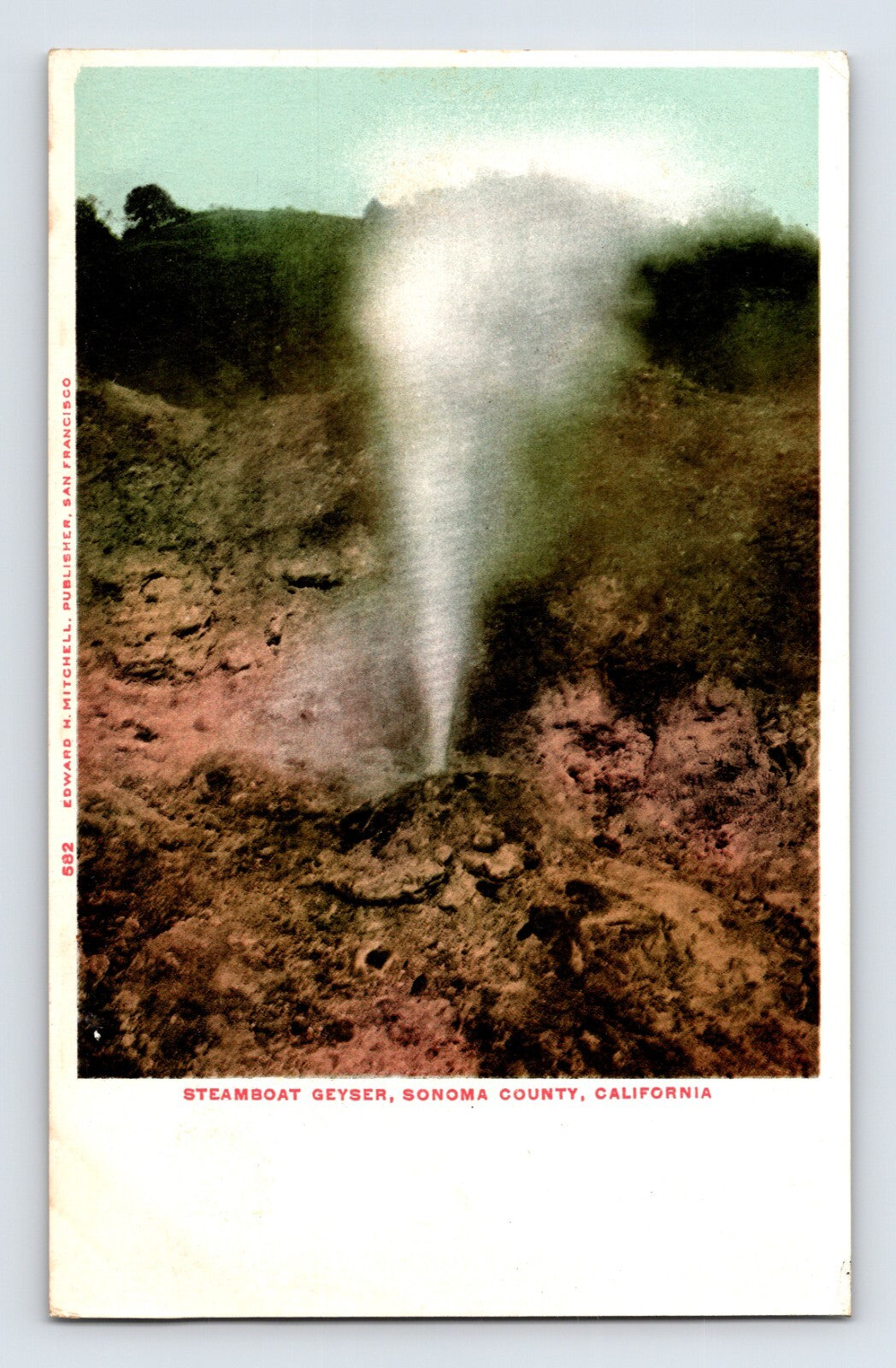 Color postcard view of Steamboat Geyser in Sonoma County, California, showing a dramatic geothermal steam eruption rising from a rocky volcanic landscape.