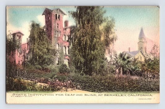 Hand-colored postcard showing the State Institution for the Deaf and Blind at Berkeley, California, with towered brick buildings and landscaped gardens; divided back with stamp box and handwritten message.