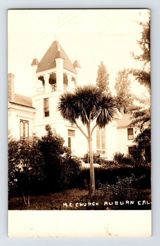 Real photo postcard of Methodist Episcopal Church Auburn California with bell tower and palm tree 1920s