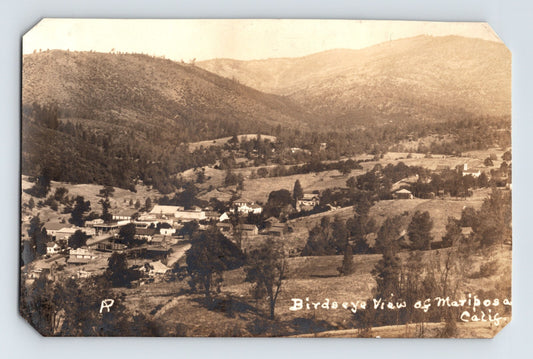 Mariposa California bird’s-eye landscape view showing town buildings, rolling hills, and scattered trees, real photo postcard 1930s