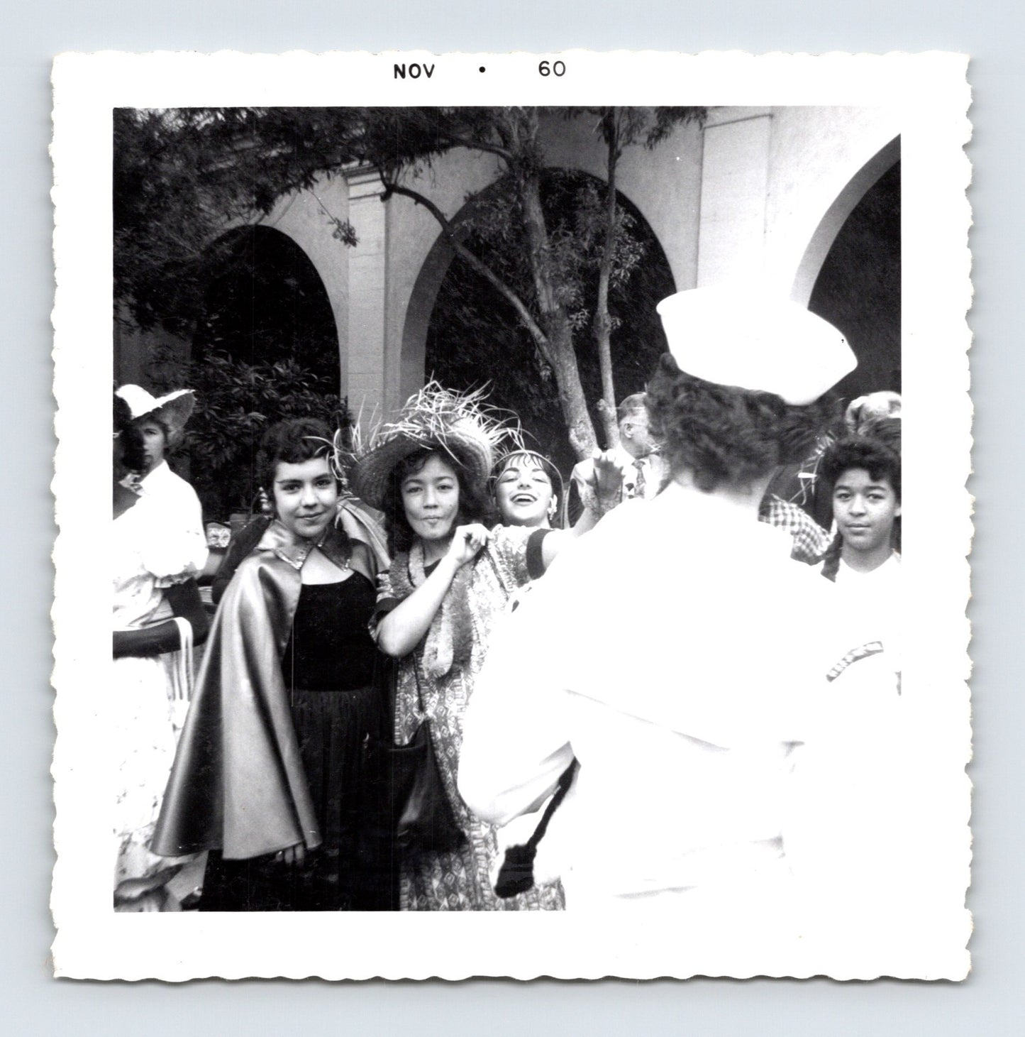 Vintage Halloween party children costumes courtyard arches 1960 snapshot black white photo