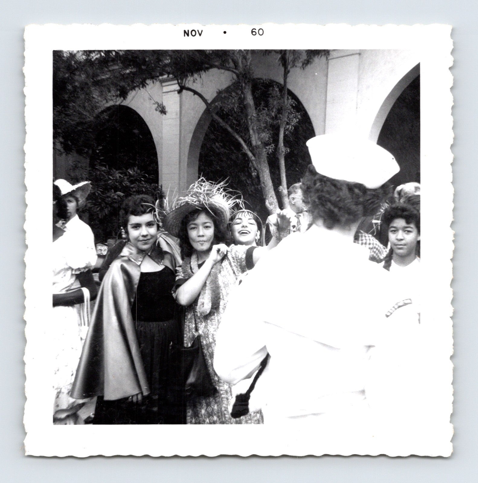 Vintage Halloween party children costumes courtyard arches 1960 snapshot black white photo