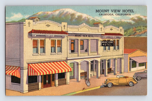 1940s linen postcard showing the Mount View Hotel in Calistoga, California, with striped awnings, parked automobiles, and mountain scenery in the background.