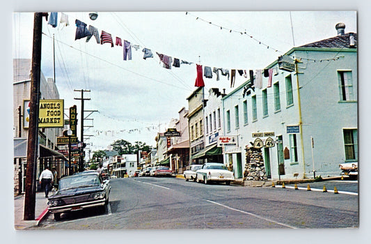 Angels Camp California downtown street view market laundry storefronts 1960s chrome postcard cars signage