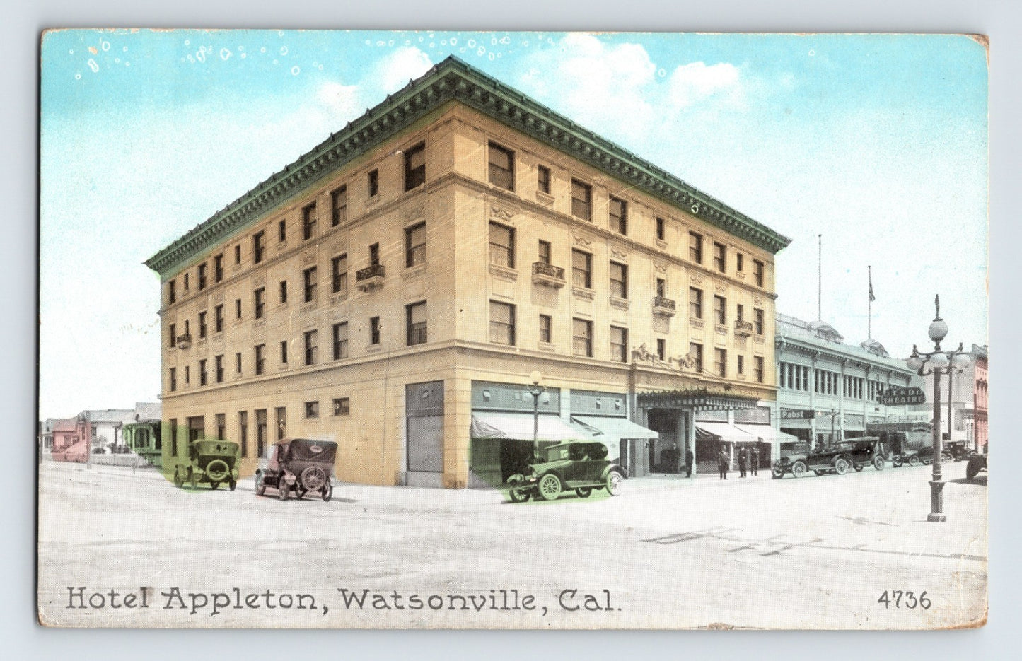 Hotel Appleton in Watsonville California showing four story corner building with early automobiles and storefront awnings along street