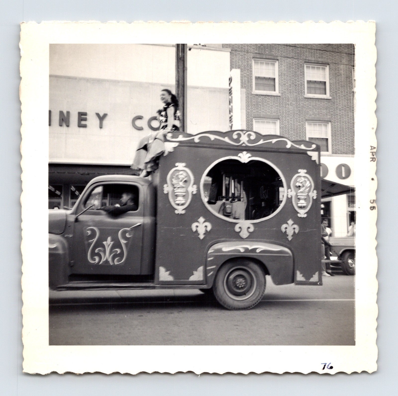 1955 Cole Bros Circus decorative parade truck snapshot photograph showing a costumed circus performer riding atop an ornate vehicle in downtown Decatur GA