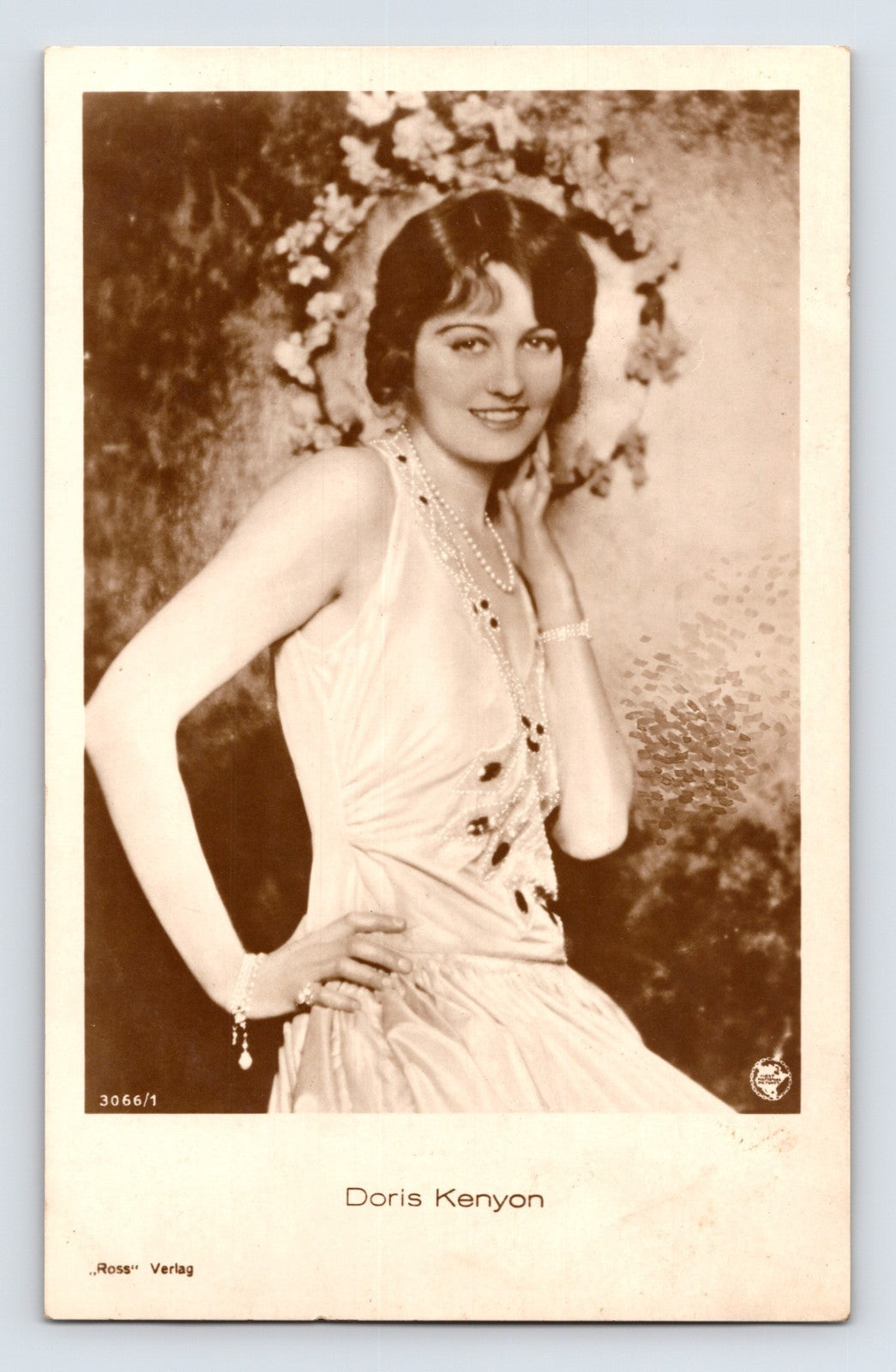 Doris Kenyon 1930s studio portrait floral backdrop Ross Verlag RPPC postcard