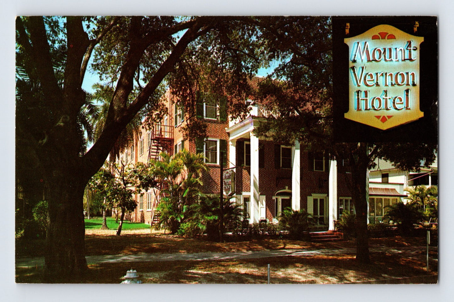 St Petersburg Florida Mount Vernon Hotel building with trees and roadside sign 1975 postcard