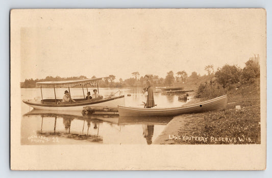 Lake Kootenay Wisconsin Reserve real photo postcard with small boats and figures along calm shoreline, 1910 divided back posted RPPC
