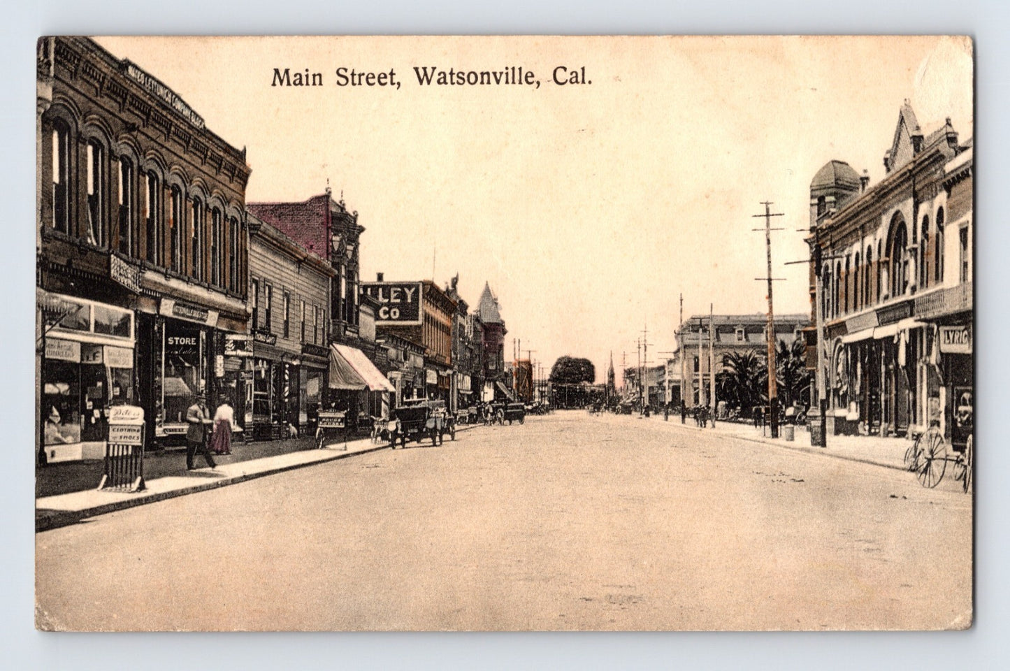 1912 Main Street Watsonville California streetscape with storefronts, pedestrians, horse-drawn vehicles, and early automobiles, postmarked with USS Maryland naval cancel.