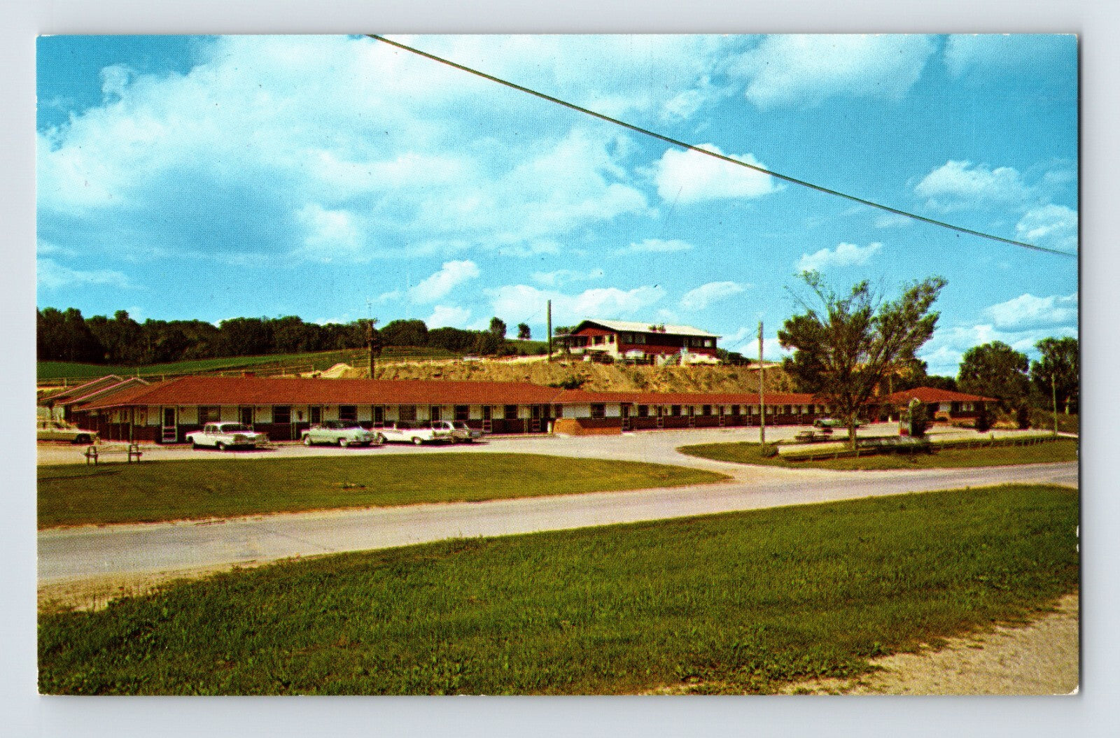 Decorah Iowa Deluxe Motel Cliff House hillside motor lodge parking lot 1960s chrome postcard