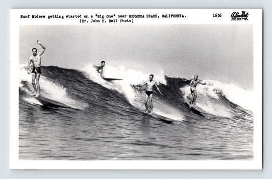 Hermosa Beach California surfers riding large ocean waves in vintage surfing postcard photograph