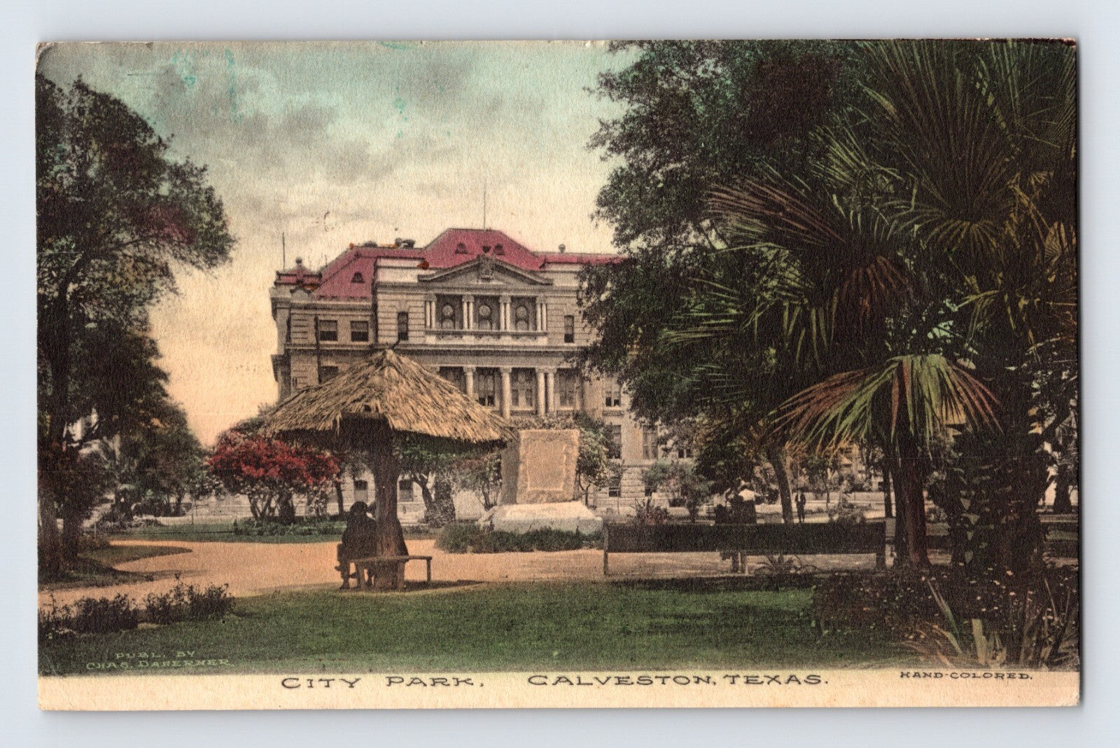 Galveston Texas City Park with palm trees pavilion and large building hand colored early postcard scene