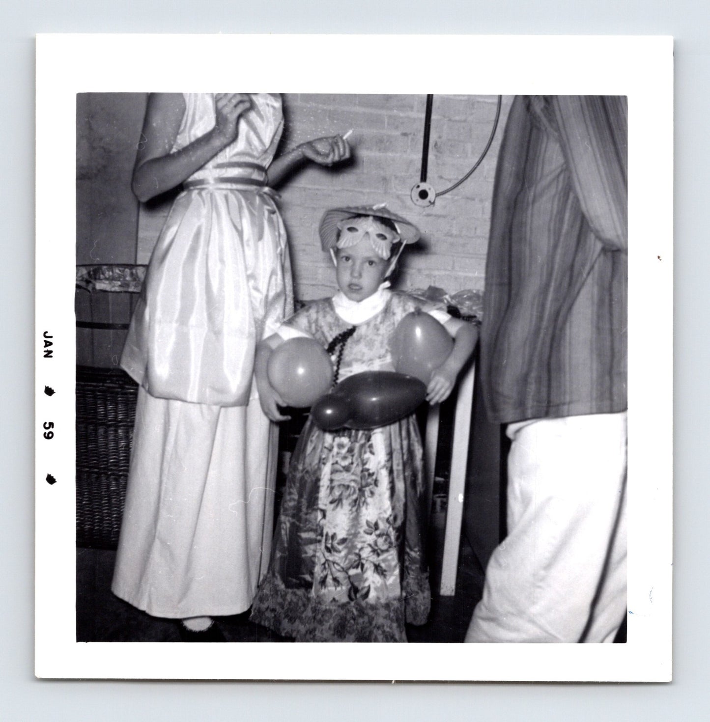 Vintage Halloween girl costume balloons mask hat 1959 snapshot black white photo party scene