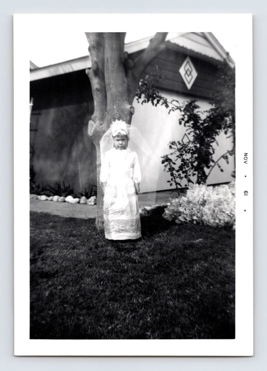 Girl Halloween angel costume veil dress yard tree house exterior November 1961 snapshot photo