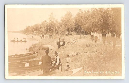 Maple Lake Minnesota Fourth of July 1915 canoe gathering real photo postcard with lakeshore crowd