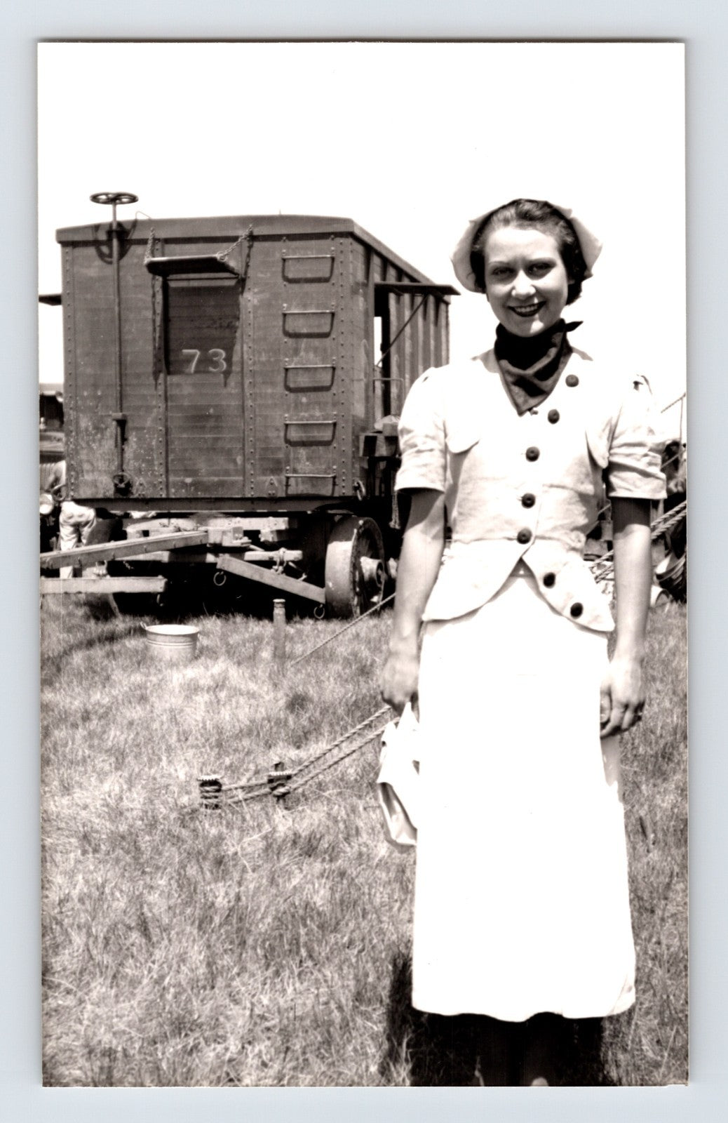 Barnes Sells Floto Circus 1940s woman performer standing beside circus wagon on circus grounds photograph