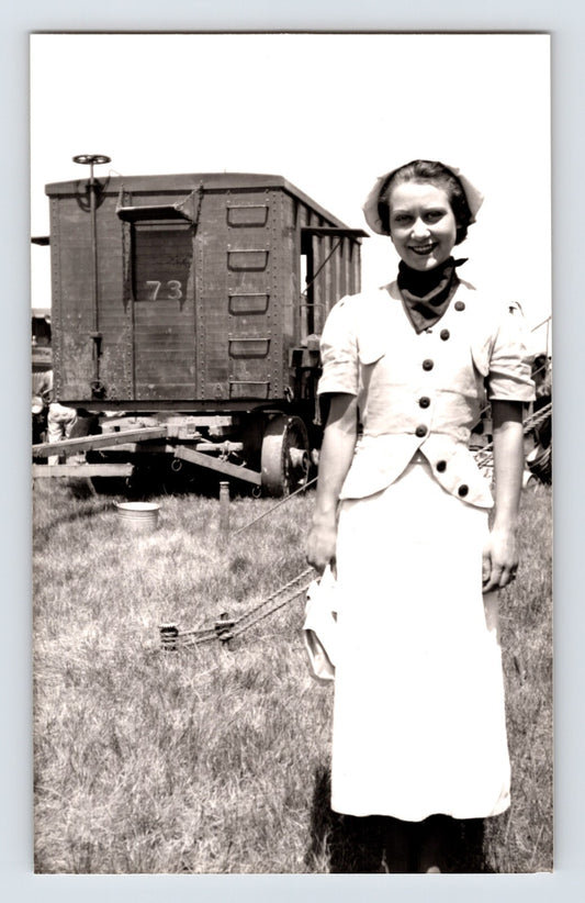 Barnes Sells Floto Circus 1940s woman performer standing beside circus wagon on circus grounds photograph