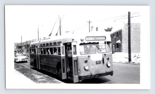New York City trolley coach 3074 Route 58 Corona Avenue Ridgewood with passengers boarding in Queens residential street scene black and white transit photo