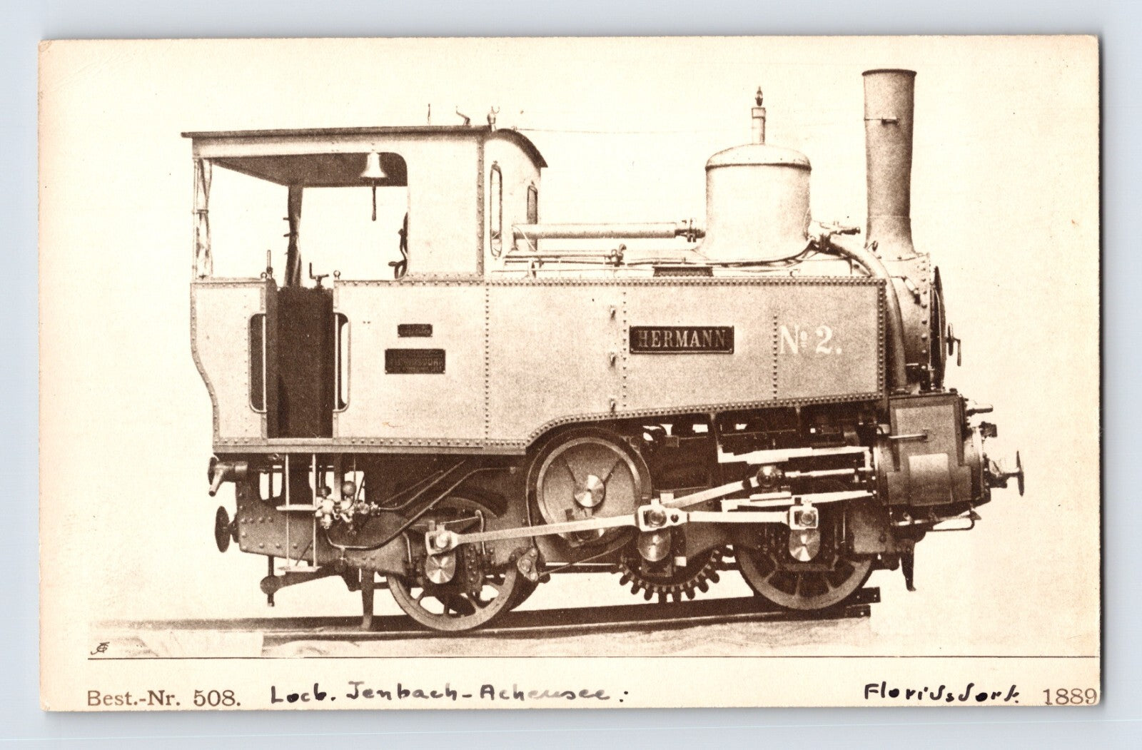 1910s real photo postcard showing the Hermann No. 2 cog railroad steam locomotive of the Jenbach-Achensee Railway in Austria in a studio-style side profile view.