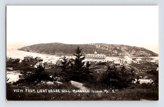 Monhegan Island Maine view from Lighthouse Hill showing harbor buildings and shoreline 1940s real photo postcard