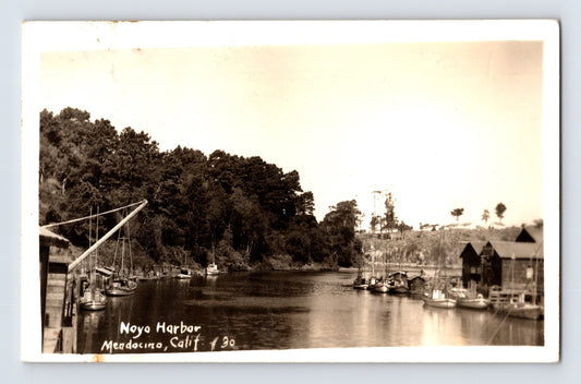 Noyo Harbor with fishing boats and waterfront buildings Mendocino California RPPC 1947 posted