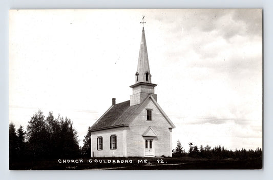 1950s Gouldsboro Maine church real photo postcard with white wooden chapel steeple and cross set against rural tree line