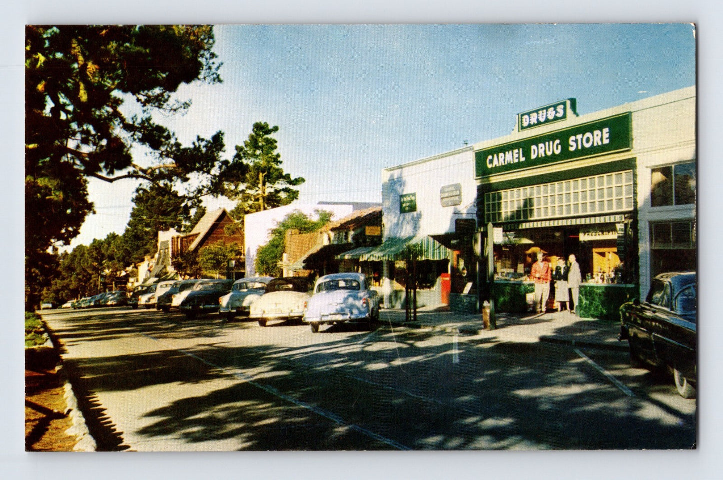 Carmel California downtown Carmel Drug Store street scene cars 1950s chrome postcard