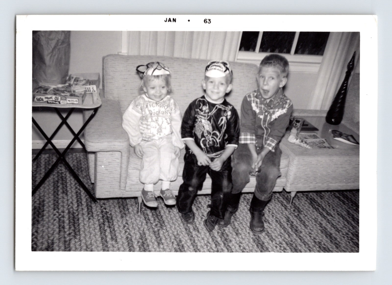 Children Halloween costumes sitting couch masks indoor 1962 snapshot photo