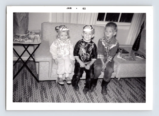 Children Halloween costumes sitting couch masks indoor 1962 snapshot photo