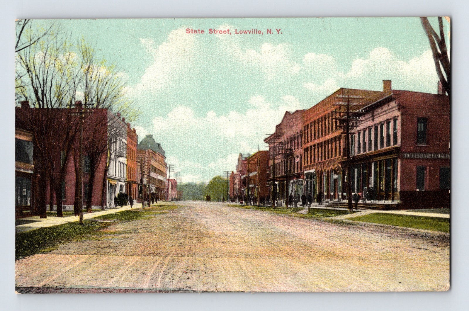 Lowville New York State Street dirt road downtown buildings early street scene 1909 postcard