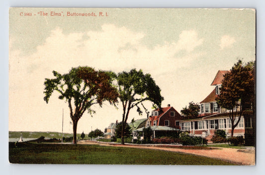 Buttonwoods Rhode Island The Elms residence along waterfront road with large trees and Victorian houses