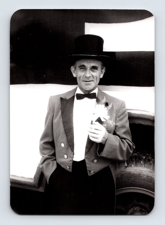 Mills Bros Circus 1962 ringmaster in top hat standing beside circus vehicle backstage photograph