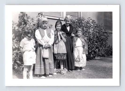 Halloween photo children costumes group yard masks capes 1960s snapshot kids dressed up outdoors house scene 3.25 x 4.5