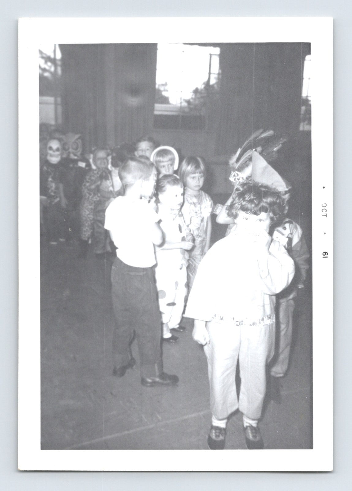 Halloween vintage photo children costume line masks classroom 1960s snapshot kids dressed up school scene 5 x 3.5